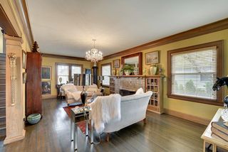 The entertainment sized Living Room features Newly Re-Finished Dark Hardwood Floors! 