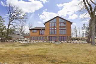 Clad Windows, Hardi Plank siding, and a stone base give the home its "broad shoulders"