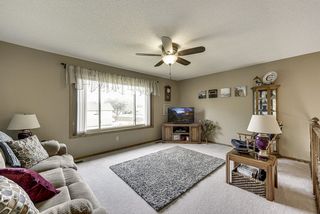 Upper level living room with views of the back yard