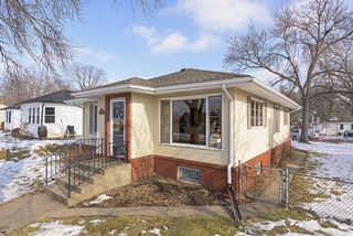This Mid-Century Modern Home is located on a quiet, tree-lined Street in trendy NE Minneapolis! 
