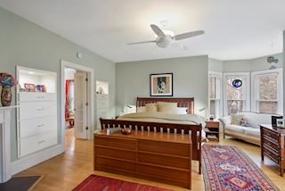 Master Bedroom with built in drawers flanking the french doors into the office