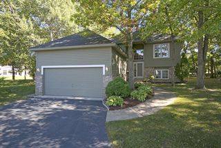 Detached, multi level town home- newer roof.