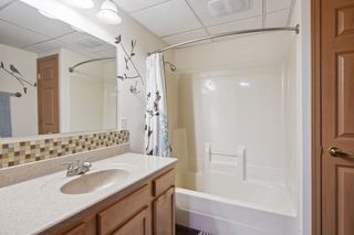 Full basement bath with heated stained concrete floor