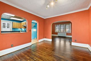 Dining room, open to living room on the right and kitchen on the left
