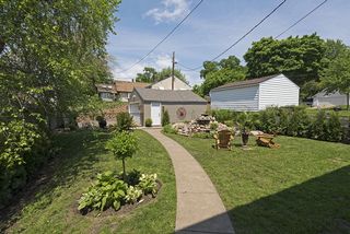 The Fully Fenced Back Yard features Perennial Gardens & Water Fountain...