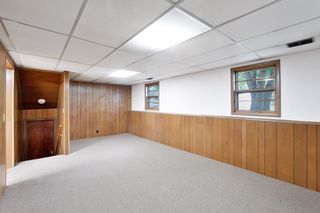 The Family Room is on the lower Third Level and has 2 lookout windows and plenty of space to entertain family and friends.