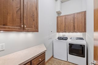 Laundry room with storage and space for folding or gift wrapping.
