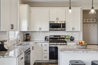 The gleaming countertops are pleasing to the eye and easy to maintain.