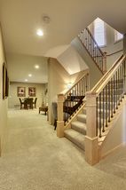 New iron railings leading to lower level with 9' ceilings