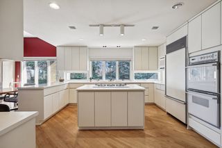 Light filled kitchen, windows under cabinets on East side of home.