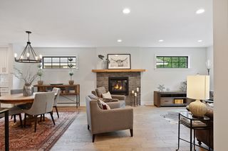 View from the foyer. Contemporary open-design
The brick fireplace acts as a great architectural divider, while still allowing flow between the living and dining areas.