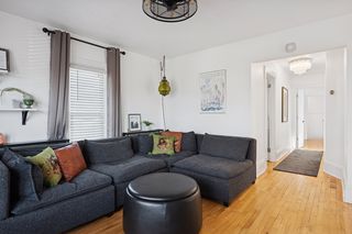 Upper level living room adjacent to 3 bedrooms