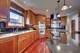Brushed stainless and pewter finishes contrast with the beautiful brazilian cherry floors.