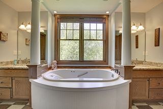 A Master Bath you won't want to leave. Cabinetry and linen space abound. Ceramic floors.
