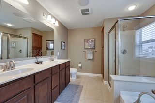Master Bath includes large shower, soaking tub, and double vanity with tons of storage. Linen closet behind shower.