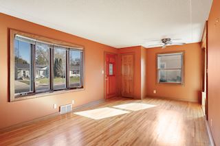 Sunlit living room with large windows
