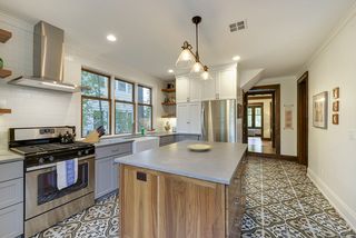 Custom enameled cabinetry and stainless steel appliances