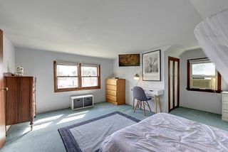 Upper Level bedroom with sunrise and lake views
