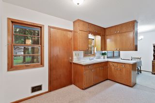 Enjoy wooded views, serving Island, extra cupboard and counter space, and walkout access to the backyard.