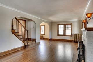 A striking stair case anchors the home and provides access to the living room, kitchen and upper levels. 