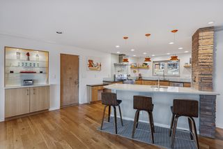 Open to Living Area the counter mimics  the ship-curve hearth