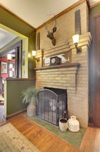 The Entry Foyer features this beautiful Wood Burning Fireplace! 