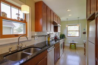 Trend setting kitchen - dishwasher, storage abounds with room for eat-in table.