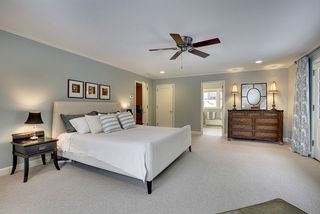 The Master Bedroom Suite features new Carpet, Lighting & Custom Window Treatments...