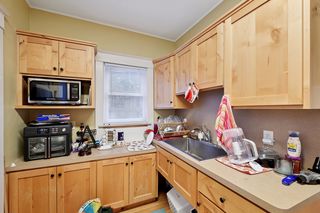 Another view of Kitchen in Apt #1.
Features updated kitchen with Custom Hickory Cabinets, Newer appliances, Sink & Faucet, Hardwood floors and Thermal Pane Windows throughout.