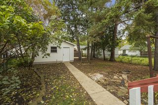 Lovely fenced-in yard with a sidewalk that leads to a 2-car insulated garage