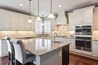Oversized kitchen island w/ Quartz countertops & prep sink