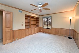 Handsome family room/bedroom with custom cabinetry