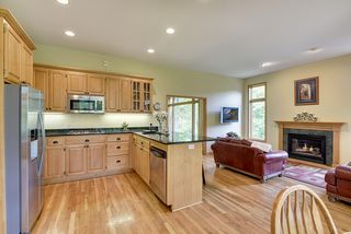The open kitchen, dining and family room with fireplace is the heart of this home!