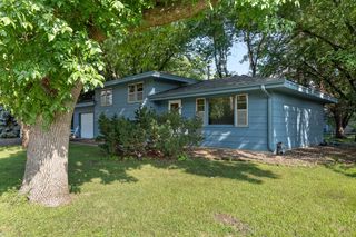 Four level Home offers a rare opportunity to own 1/2 ACRE wooded lot for the first time in 51 years!  "Move-in ready", well maintained, features an open floor plan with walkout main level to a beautiful backyard and huge patio. Centennial Schools!