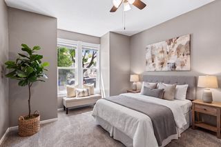 Virtually staged lower unit primary bedroom at approx 14x13