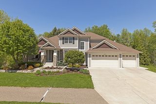 Beautiful front entry, concrete driveway and walk. A mans dream garage - storage galore, insulated and heated.