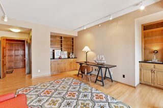 Den with french doors into both the front entryway and living room
