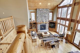 The loft looks straight west encompassing spectacular views over the Main floor area and through the expansive glass westward.