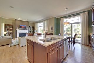 The island features a double sink conveniently located next to the dishwasher.