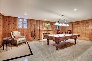The Lower level Family Room/Billiard Room features newly restored, original Terrazzo Floors.