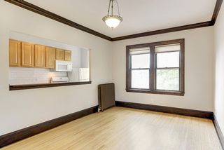 High 9' ceilings with crown molding and natural woodwork.