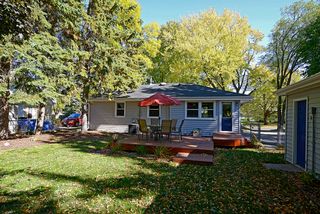 Well kept yard with storage shed behind double garage