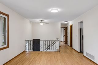 Refinished hardwood floors extend throughout the main level