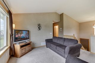 Living room and upper level has a pleasing and neutral decor