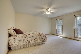 Spacious second Bedroom upstairs. Large double hung windows frame this space.