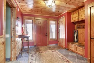 No detailing has been left out - slate entry flooring, a blend of wood accent in Alder, Cherry complimented by a t&g wood ceiling.