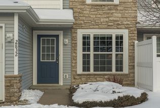 Warm, inviting entrance with beautiful brick exterior