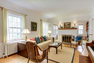 Nice-sized living room with a classic brick fireplace