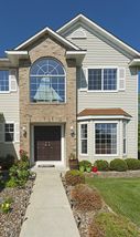 Dramatic two story home with double door entrance