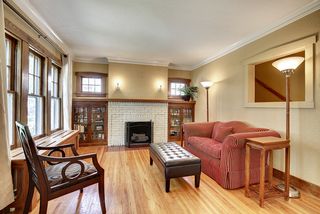 The Living Room features Hardwood Floors & Wood Burning Fireplace....